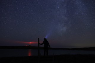 Dani on Ynys Enlli, looking at the Milky Way